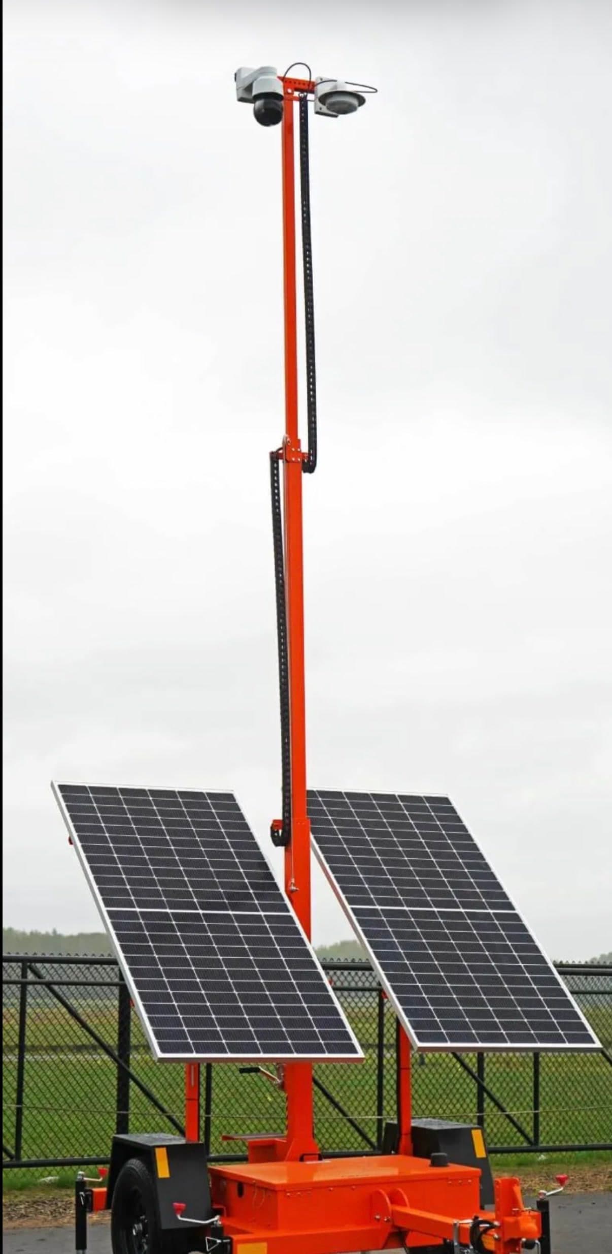 Solar-powered mobile security trailer with 360° cameras, ready to tow to a Conway job site